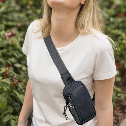 The Stay Safe Self Defense Kit compact pouch worn crossbody for personal safety and travel readiness.